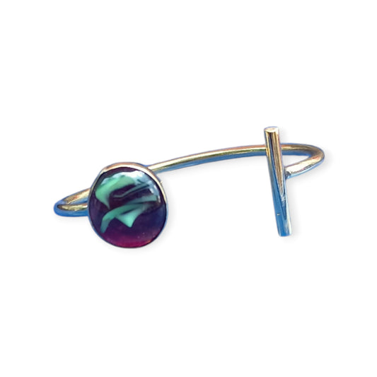 adjustable open cuff bracelet made of polished brass from Kenya, showcasing a single, abstract amber piece with rich internal details.