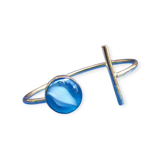 Unique Kenyan brass cuff bracelet with a modern, artistic design, adorned with a one-of-a-kind azure and white swirl gemstone.