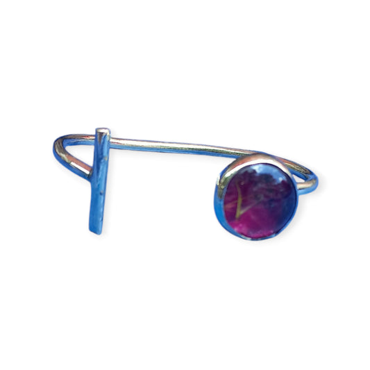 Adjustable open cuff bracelet made of polished brass from Kenya, accented with a unique, rich red or purple ornament.