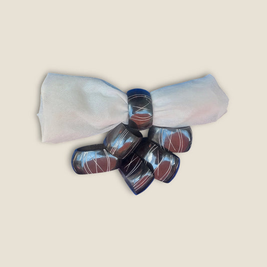 Kenyan handcrafted bone napkin rings set of 6 with etched geometric patterns.