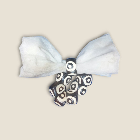 Kenyan handcrafted bone napkin rings set of 6 with unique concentric circle pattern.