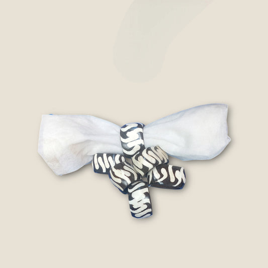 Kenyan handcrafted bone napkin rings set of 6 with unique wavy pattern.