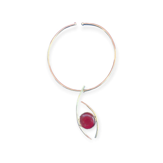 Kenyan-made polished brass choker with a prominent round, domed deep pink stone pendant