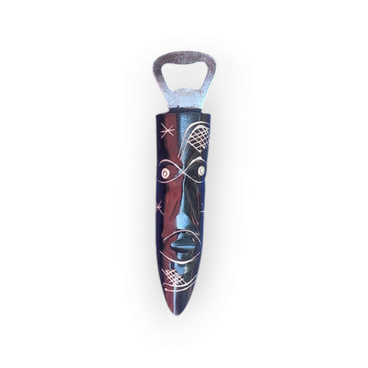 Kenyan handcrafted bone bottle opener with tribal African mask design.