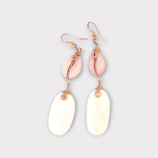 Handcrafted Kenyan earrings featuring a white cowrie shell and a smooth white bone pendant
