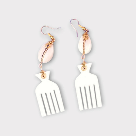 Dangle earrings with a small white cowrie shell connected to a distinctive Afro pick made of bone, crafted in Kenya