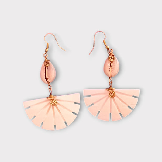 Handcrafted Kenyan earrings featuring a white cowrie shell and a unique, fan-shaped bone pendant with radiating slots.