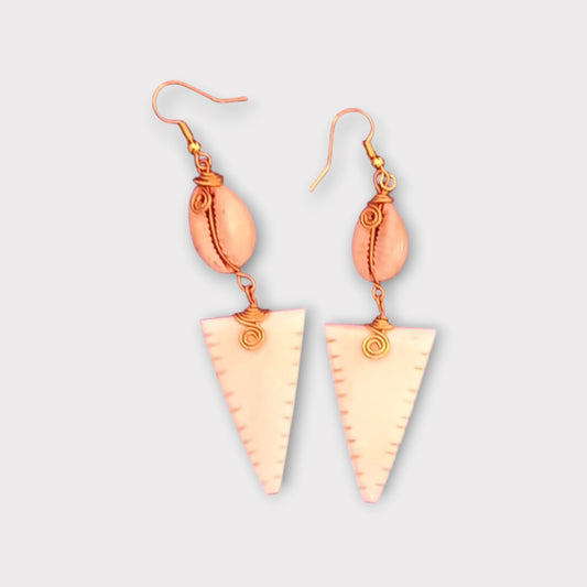 Elegant Kenyan-made earrings combining a natural cowrie shell with a uniquely notched bone drop.
