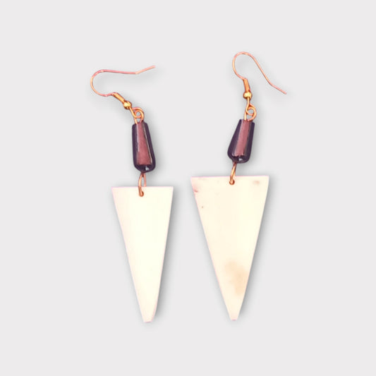 Modern geometric dangle earrings with a bone triangle, made in Kenya.