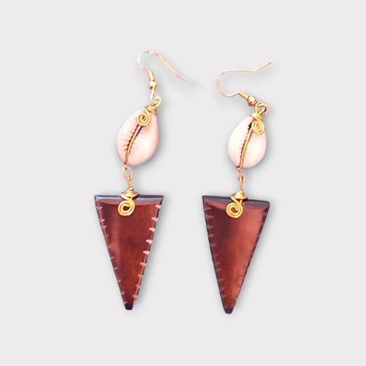 Kenyan earrings made of bone and cowrie shell, with a brown striped inverted triangular dangle and gold-toned wire accents.