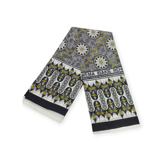 Authentic Rivatex leso pair (Kanga) from Kenya, showcasing intricate black, white, and yellow print. 