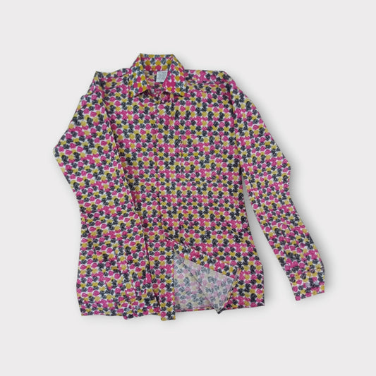 Kenyan-made Rivatex 'Uhuru' shirt: a comfortable and fashionable choice with a distinctive playful print.