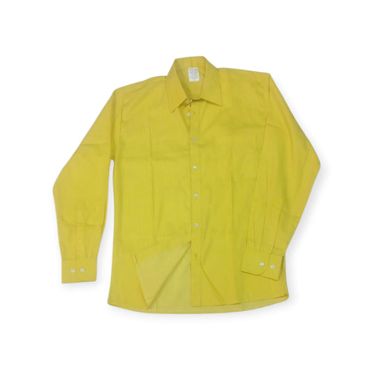 Kenyan textile artistry: the 'Uhuru' shirt by Rivatex, a bold yellow cotton button-down shirt.