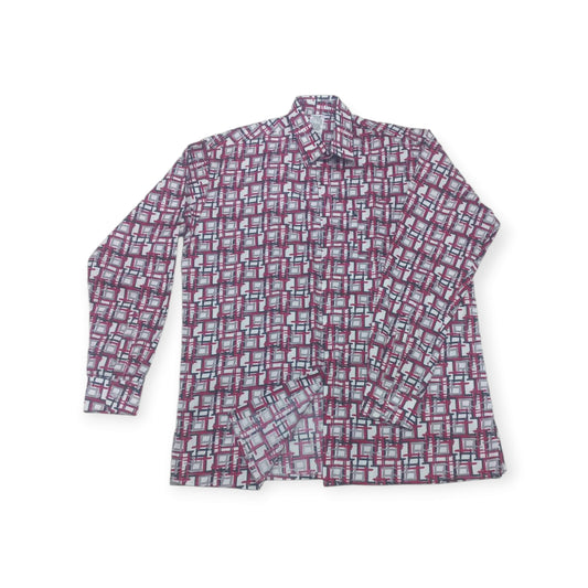 A modern and eye-catching 'Uhuru' shirt from Rivatex, showcasing its bold geometric motif on soft cotton.