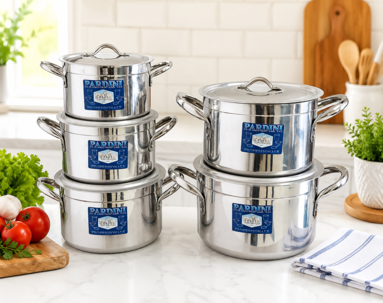 Pardini 705 series deep aluminium casserole sufurias by Kaluworks stacked on a light marble kitchen counter with silver lids and blue brand labels