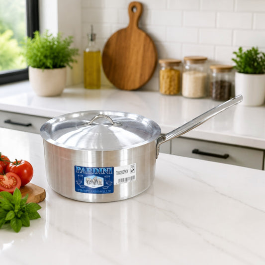 Pardini Professional medium height aluminium saucepan with long handle and lid manufactured by Kaluworks on a kitchen counter