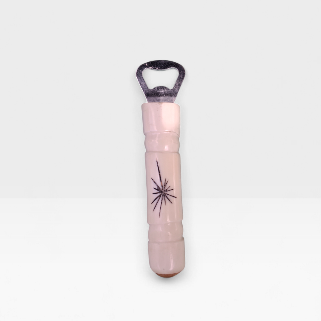 Handcrafted starburst cow bone bottle opener with hand etched sunburst engraving made by Kibera artisans in Kenya