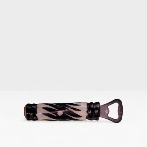 Handcrafted zebra batik cow bone bottle opener with black diagonal stripes made by Kibera artisans in Kenya